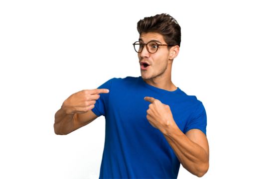 Young caucasian handsome man isolated surprised pointing with finger, smiling broadly.