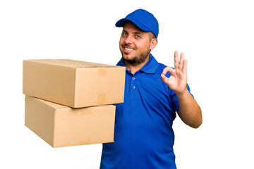 Delivery caucasian man isolated cheerful and confident showing ok gesture.