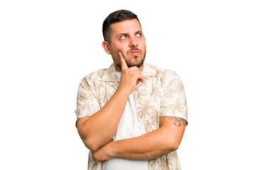 Young caucasian man isolated contemplating, planning a strategy, thinking about the way of a business.