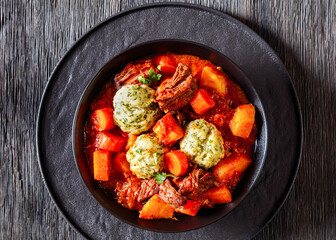Beef Stew with Dumplings in bowl, top view
