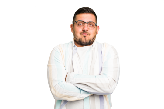 Young caucasian man isolated blows cheeks, has tired expression. Facial expression concept.