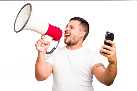 Young caucasian man holding megaphone in streaming with a phone isolated