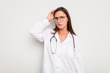 Fototapeta premium Young doctor woman isolated on white background being shocked, she has remembered important meeting.