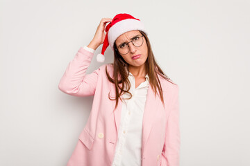 Business caucasian woman wearing a christmas hat isolated on white background being shocked, she has remembered important meeting.