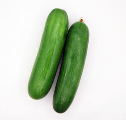 Green cucumbers, isolated on a white background. A fresh vegetable photography