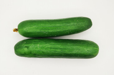 Green cucumbers, isolated on a white background. A fresh vegetable photography