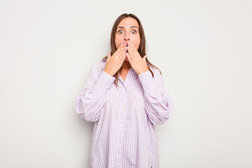 Young caucasian cute woman isolated on white background shocked, covering mouth with hands, anxious to discover something new.