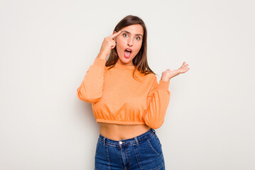 Young caucasian cute woman isolated on white background showing a disappointment gesture with forefinger.