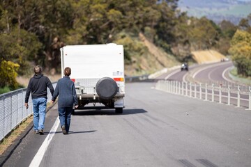 old couple travelling on a vaccation on a highway in america