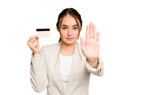 Young caucasian woman holding a credit card isolated on green chroma background standing with outstretched hand showing stop sign, preventing you.