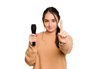 Young caucasian singer woman isolated on green chroma background showing number one with finger.