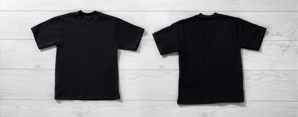 Front and back views of boy in black t-shirt on white background. Mockup for design