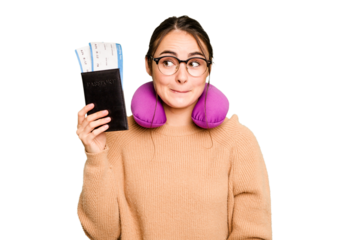 Young caucasian woman with inflatable travel pillow holding passport isolated on green chroma background confused, feels doubtful and unsure.