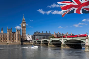 Foto op Plexiglas Big Ben with red buses on bridge over Thames river with boat in London, England, UK © Tomas Marek