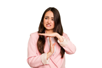 Young caucasian woman isolated on green chroma background showing a timeout gesture.