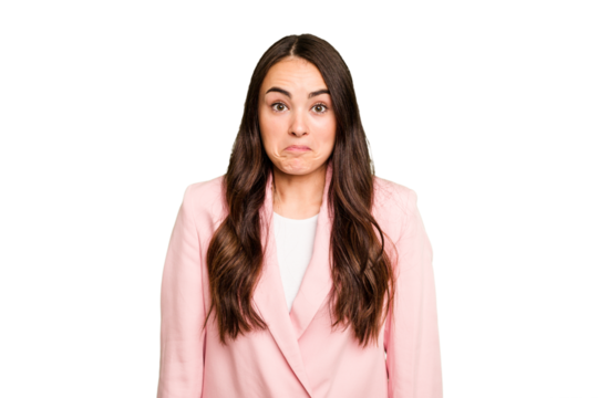 Young caucasian woman isolated on green chroma background shrugs shoulders and open eyes confused.