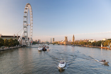 Panorama of London with boat on Thames river against Big Ben, England, UK