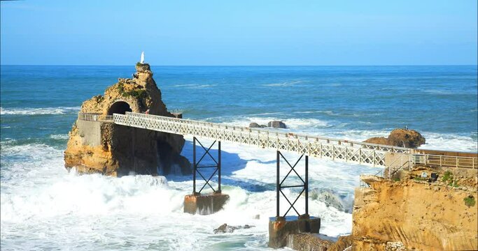 Waves crashing on the famous "Rocher de la Vierge" in the city of Biarritz in southwestern France (in slow motion)