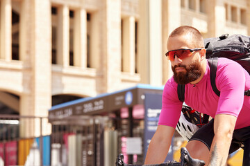 Professional handsome cyclist rides a bicycle in the city