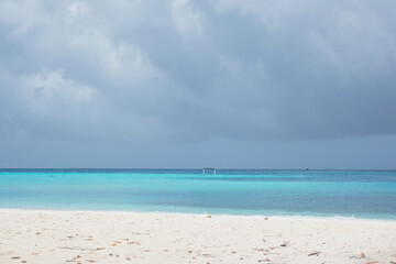 Fototapeta na wymiar Beautiful beach of Fulidhoo, Maldives during raining season, with gloomy weather.
