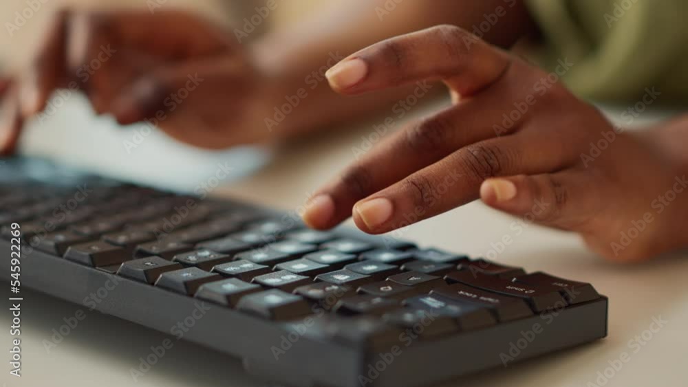 Poster manager typing data report on computer, using keyboard to create online network and send professiona
