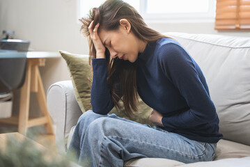 Obraz premium young woman gripping her stomach have abdominal pain .