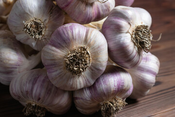 Bunch of garlic on wooden table close up