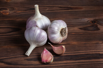 Garlic bulb on wooden background. Close up