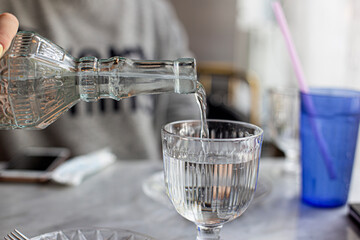 glass water bottle and goblet