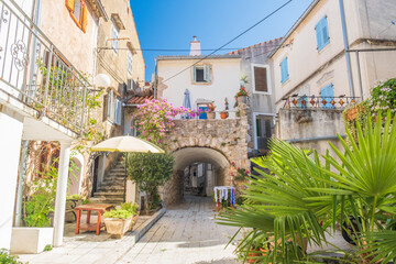 Old romantic street in town of Omisalj, Krk island in Croatia