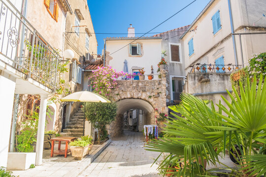 Fototapeta Old romantic street in town of Omisalj, Krk island in Croatia