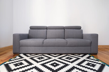 grey couch and carpet in living room