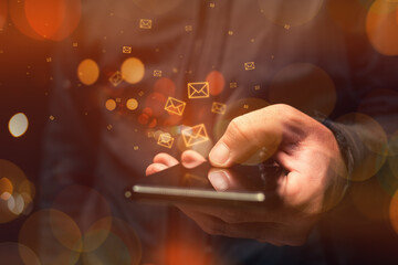 SMS or text messaging service on smartphones, male hand tapping mobile phone