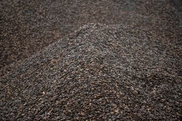 Large pile of black coal. Heaps of coal. Industrial coals. It can be used as a fuel for coal industry.