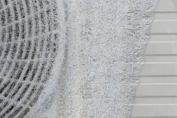 Close up of an air conditioner covered with cracked ice crust