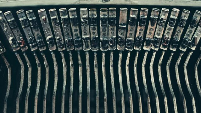Typo keys of a old manual typewriter typing on a retro writing machine, close up