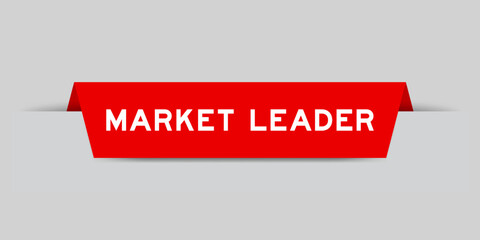 Red color inserted label with word market leader on gray background