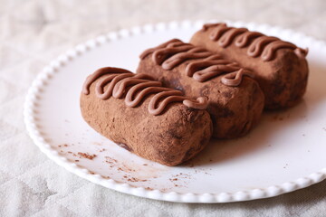 Chocolate cakes on a plate close-up