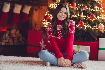 Photo of adorable nice pretty lady teen wear red sweater sitting floor room house relax rest enjoy cozy time miracle winter holiday event