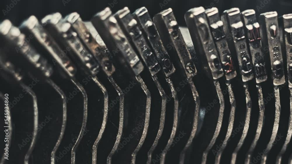 Poster letters and numbers on typo keys of an old manual typewriter on a retro writing machine, close up vi