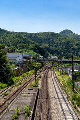 Fototapeta na wymiar railroad tracks run through the countryside in Yamanashi prefecture, Japan.