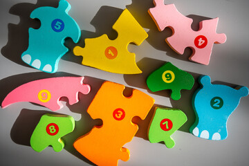 Colorful puzzle blocks signed by numbers, an alternative method of children education.