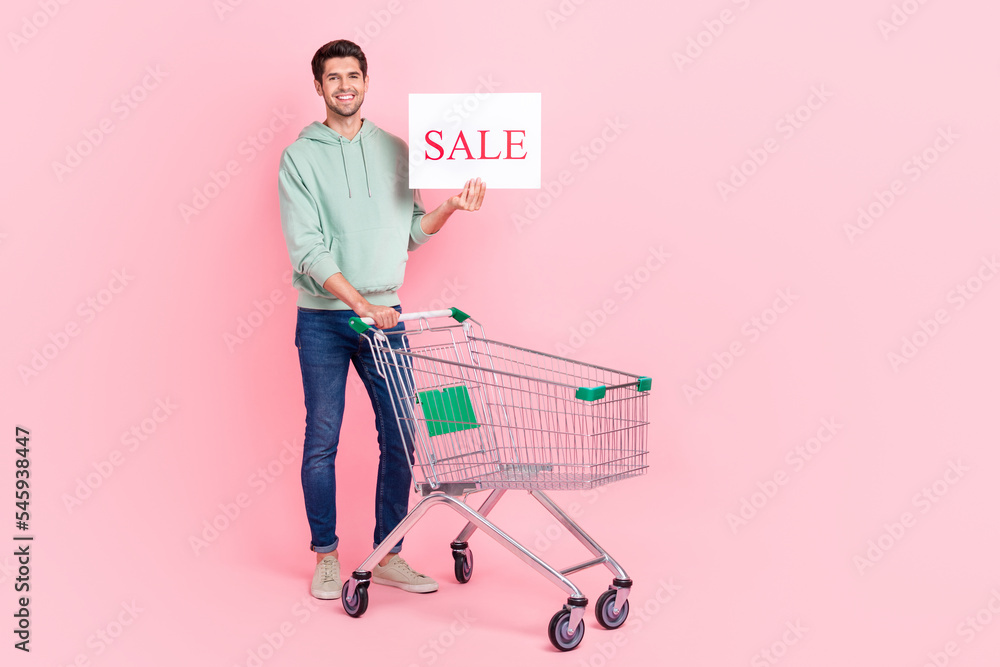 Poster full length photo of attractive trendy sweatshirt hold paper share news low price shop stand empty s