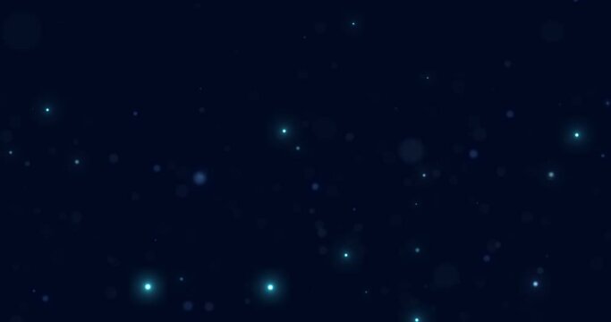 Glowing and sparkling blue particles fall in space on a blue background. Abstract star rain. Bokeh.