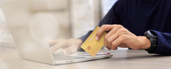 Businessman holding credit card for online shopping bill on smartphone, positive man shopping online remote payment , smart payment concept individual bank