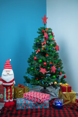 Christmas tree with gifts. vertical photo.