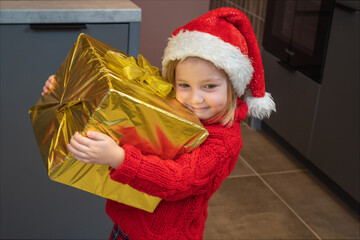 Santa Claus is giving presents to children at home. Merry Christmas and Happy New Year. Miracle time