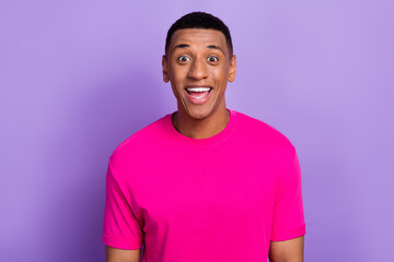 Photo of handsome impressed speechless guy with box haircut dressed pink t-shirt staring open mouth isolated on purple color background - obrazy, fototapety, plakaty