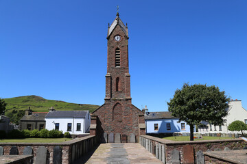 Fototapeta na wymiar St. Peter's Clock tower, part of a ruined church in Peel on the Isle of Man.