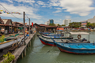Fototapeta na wymiar Historical Chew Jetty with wooden fishing boats, Unesco World Heritage site, George Town, Penang, Malaysia